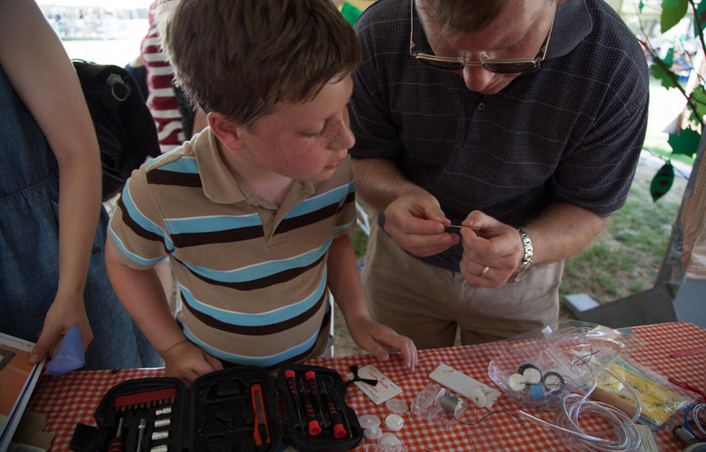 Father and son doing hands-on learning about technology. Photo by Octaviano Merecias-Cuevas.