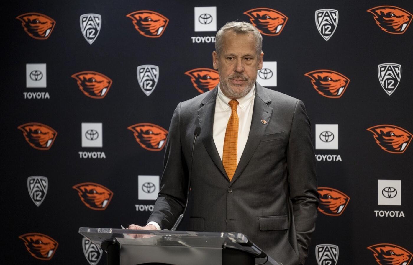Scott Barnes standing in front of a podium