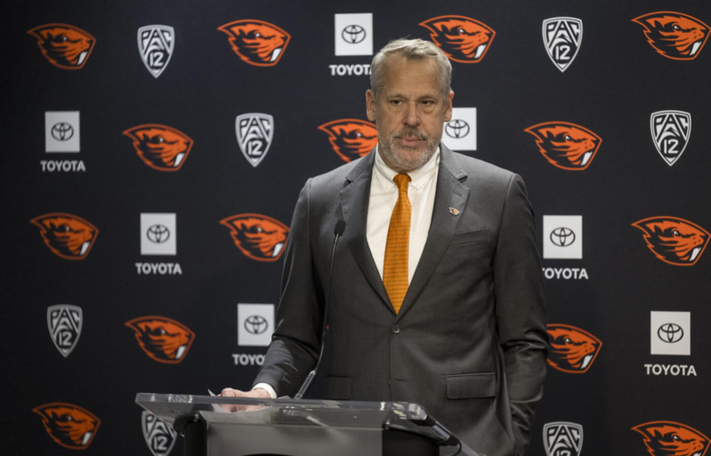 Scott Barnes standing in front of a podium