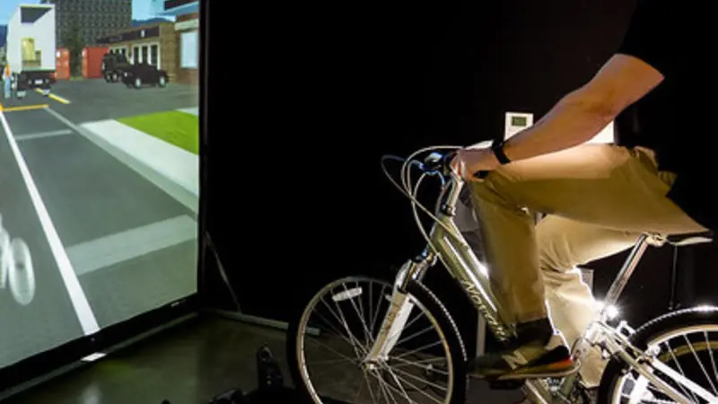 Doctoral student Doug Cobb in the OSU bicycle simulator.