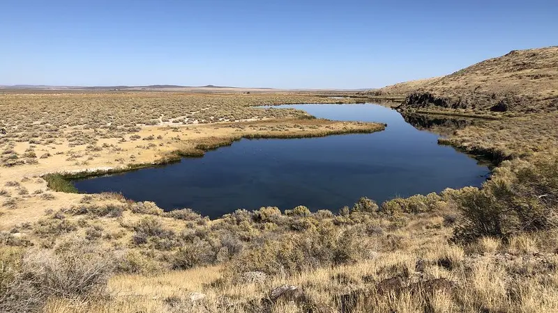 spring surrounded by high desert landscape