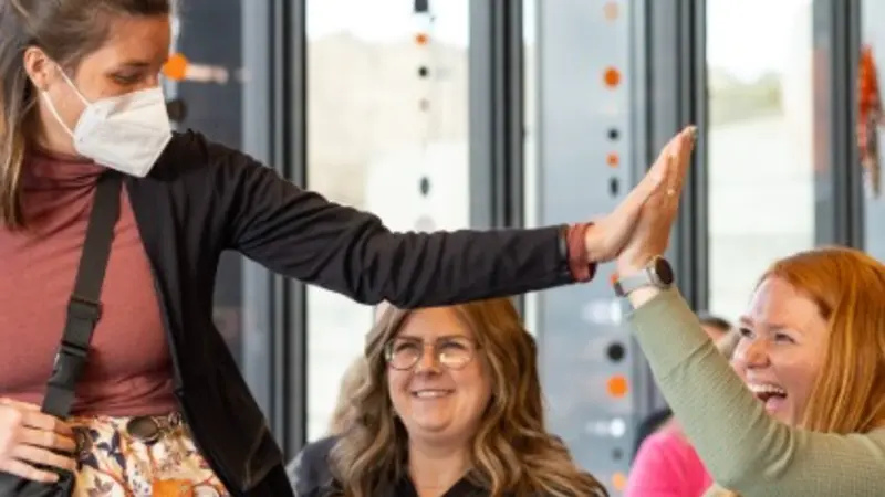 Women exchanging high-five