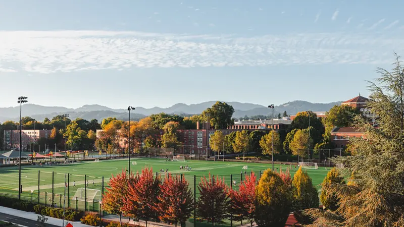 Oregon State intramural fields with trees and mountains in distance