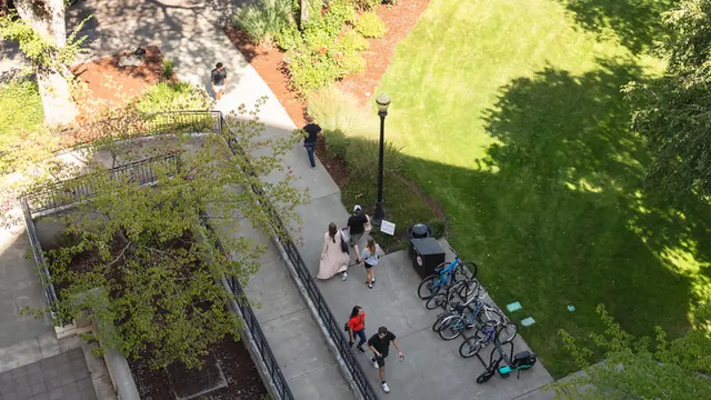 Aerial photo of people on sidewalk on Corvallis campus