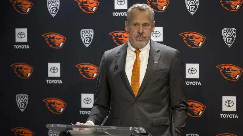 Scott Barnes standing in front of a podium.