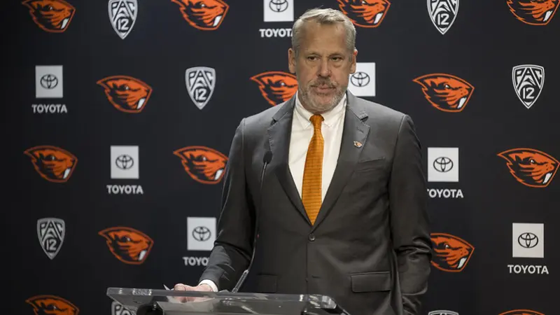 Scott Barnes standing in front of a podium
