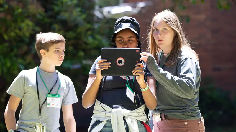 Oregon State University Extension Service 4-H'ers fly a drone. Photo by Amanda Loman.