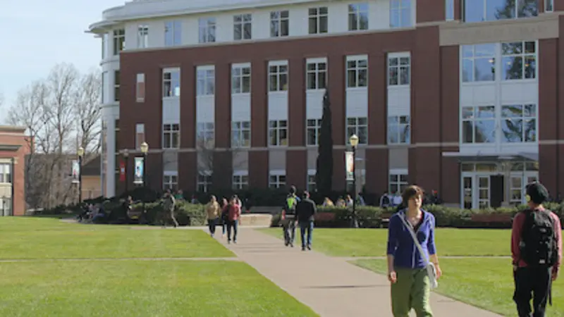 Stock image of students walking near the library on OSU campus