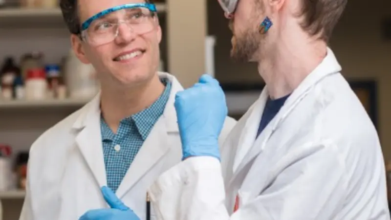 Ryan Mehl, left, in lab