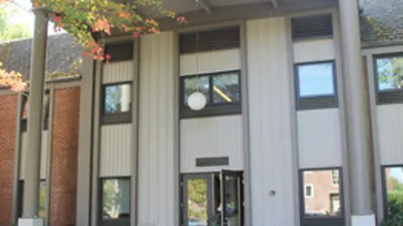 Stock image of Reed Lodge, gray and white building on OSU campus that houses the psychology department