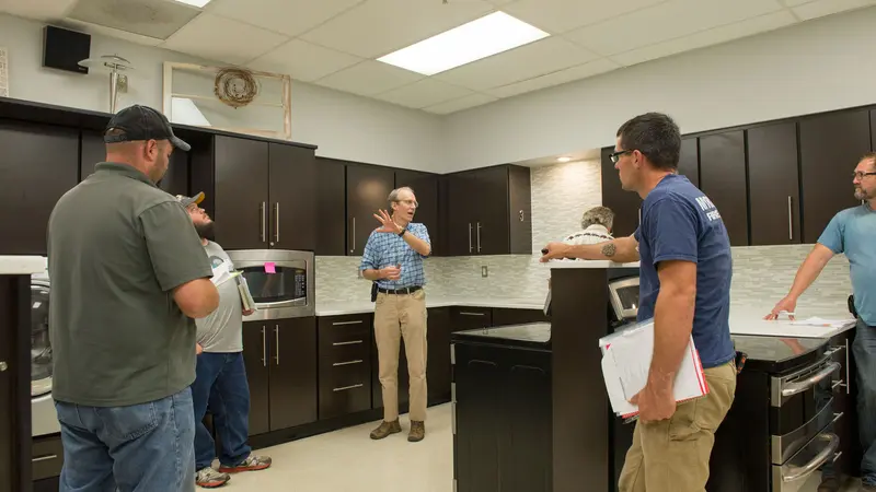 Tim Stock (center), coordinator of the Oregon State University School IPM Program, conducts training at West Albany High School in 2017
