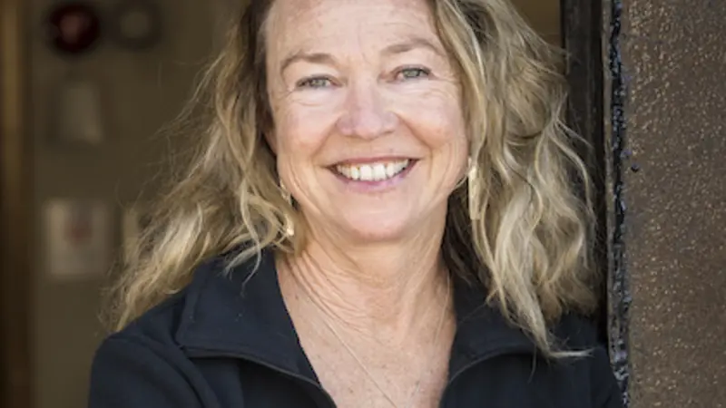 Headshot of Lisa Ballance, one of this year's fellows, wearing a black OSU-emblem jacket over a white shirt.