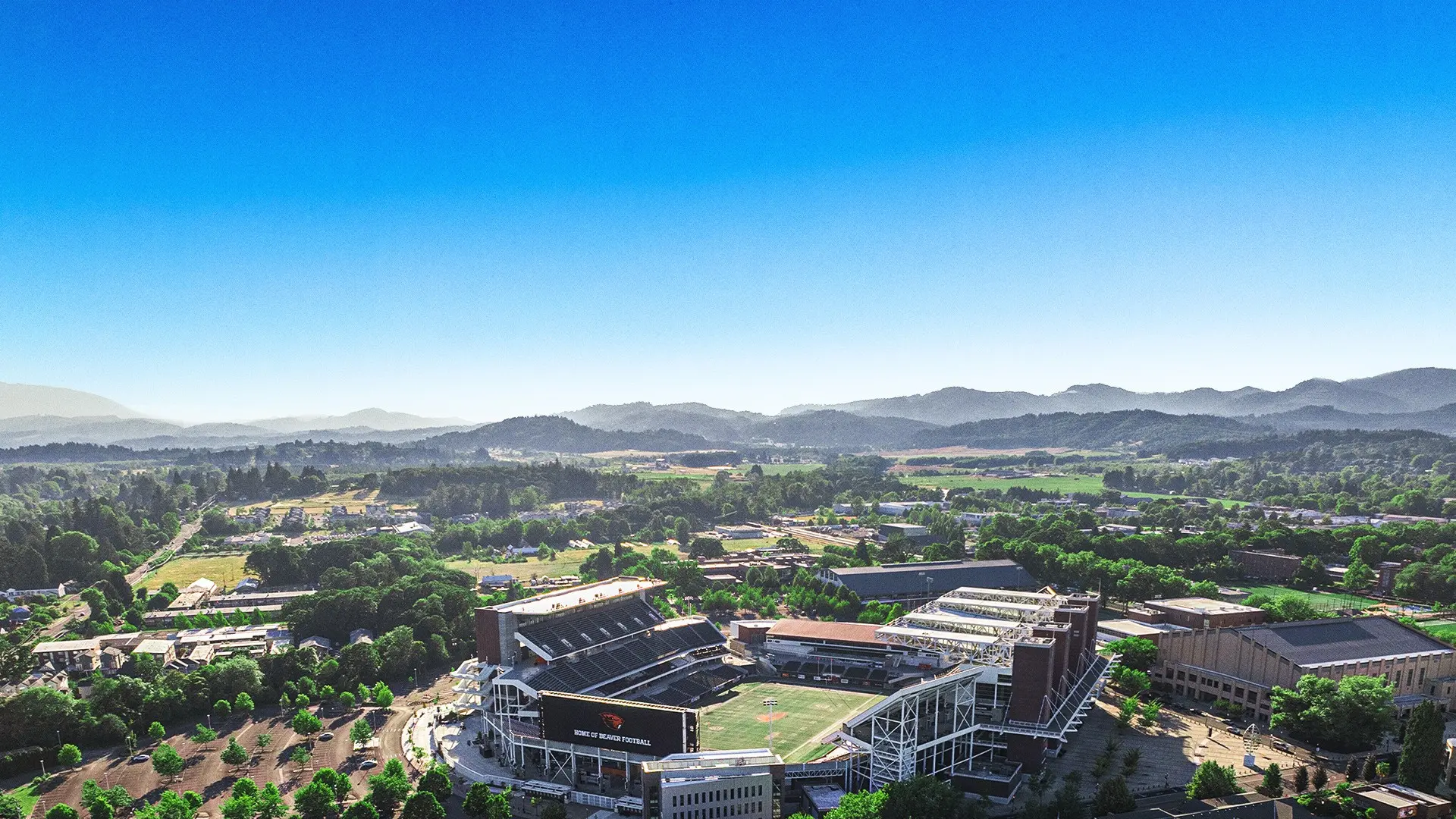Reser Stadium from the air with hills in background