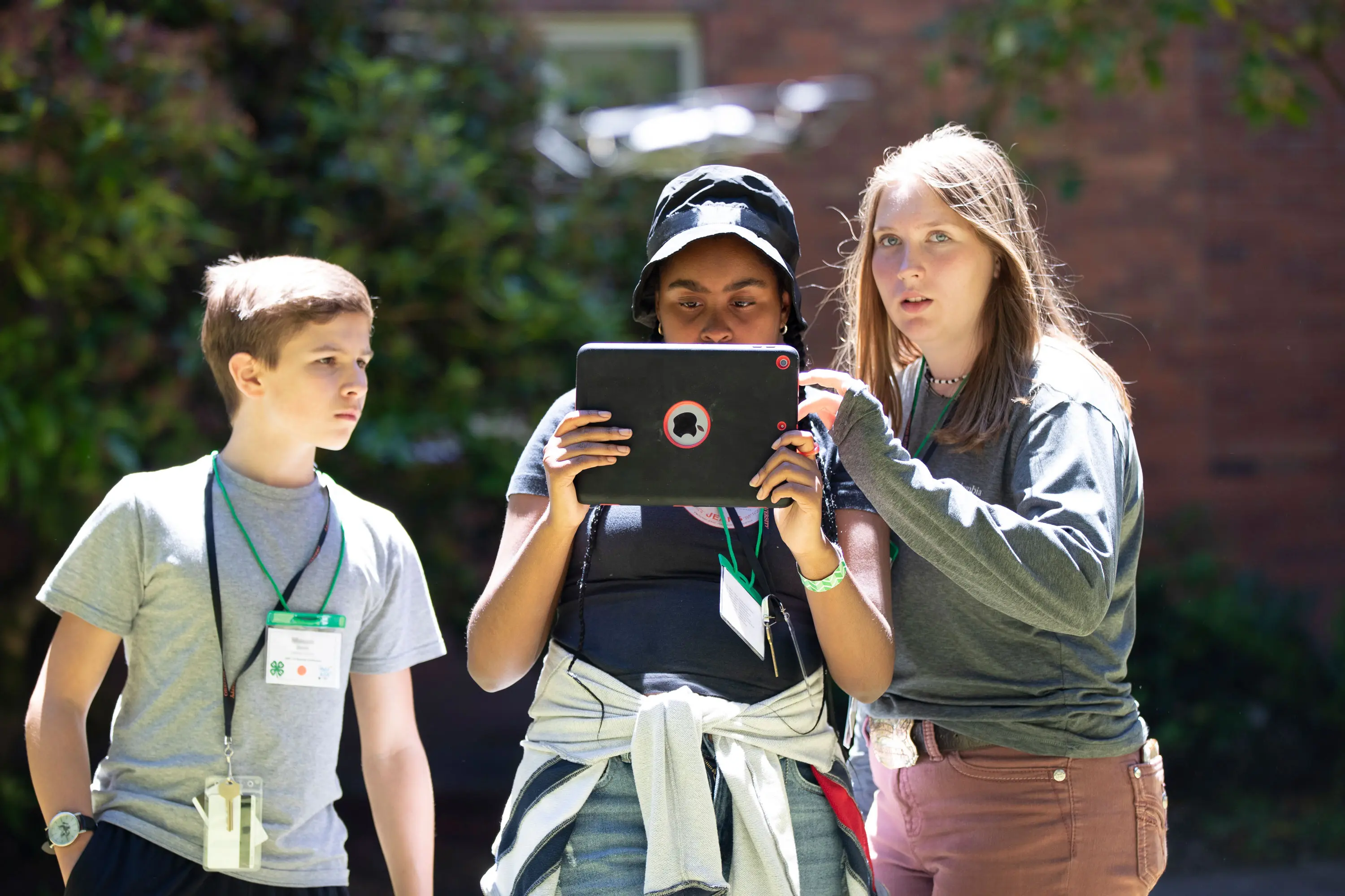 Oregon State University Extension Service 4-H'ers fly a drone. Photo by Amanda Loman.