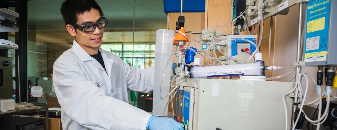 College of Engineering graduate student Quang Ngoc Tran demonstrates hybrid filtration technology being developed at Oregon State University to make agriculture more sustainable. Photo by Johanna Carson.