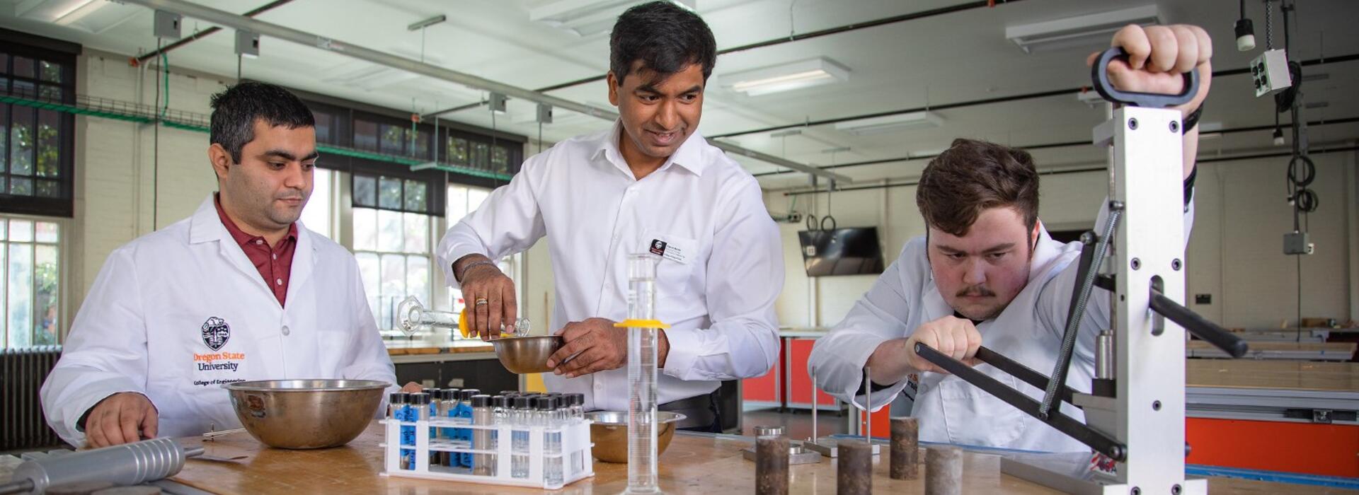 Akula, center, and students in lab (photo by Johanna Carson)