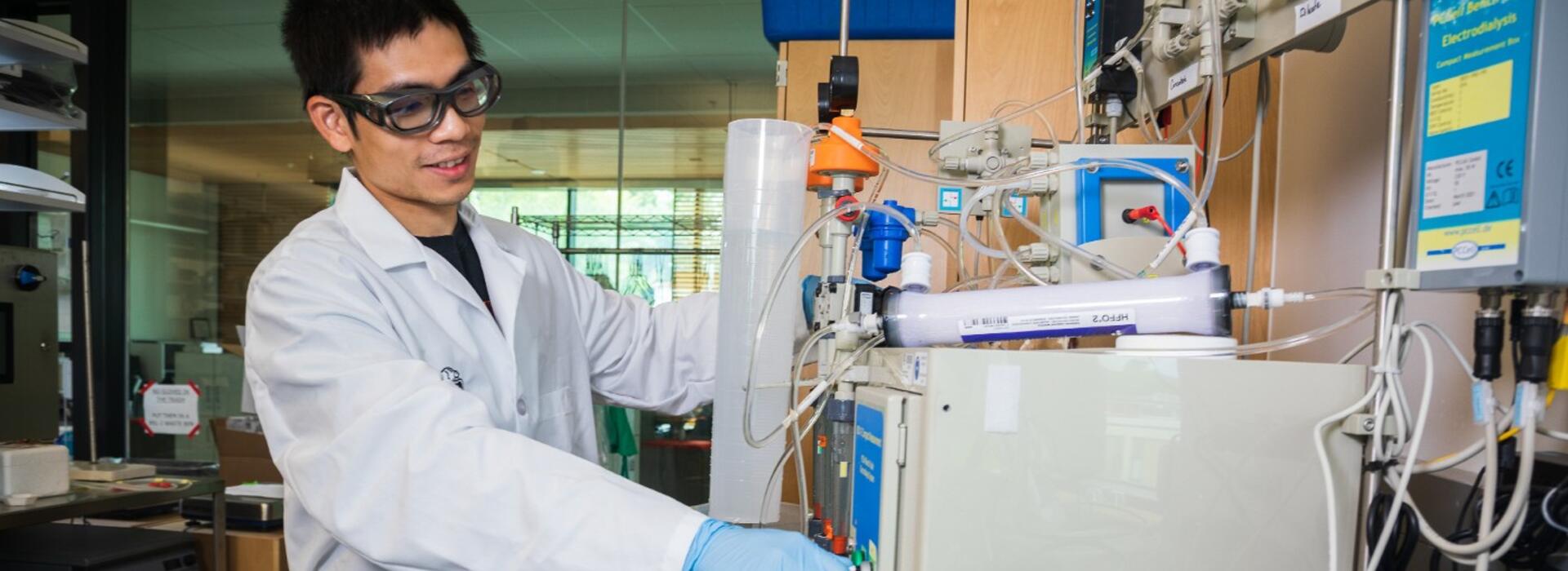 College of Engineering graduate student Quang Ngoc Tran demonstrates hybrid filtration technology being developed at Oregon State University to make agriculture more sustainable. Photo by Johanna Carson.