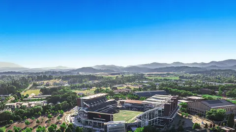 Oregon State University's football stadium Reser Stadium from the air with hills in the background.