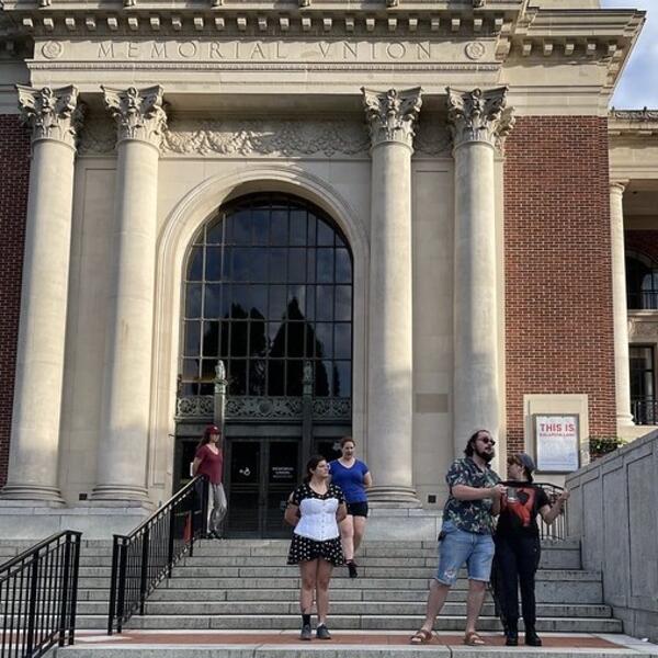 People on the outside front steps of the Memorial Union.